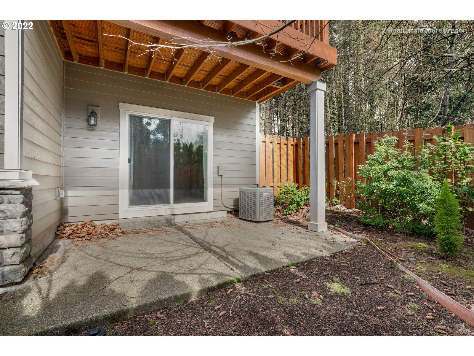 11510 Northwest Knightsview Lane Portland, OR 97229 - Photo 29 of 32 a view of a house with backyard and glass windows