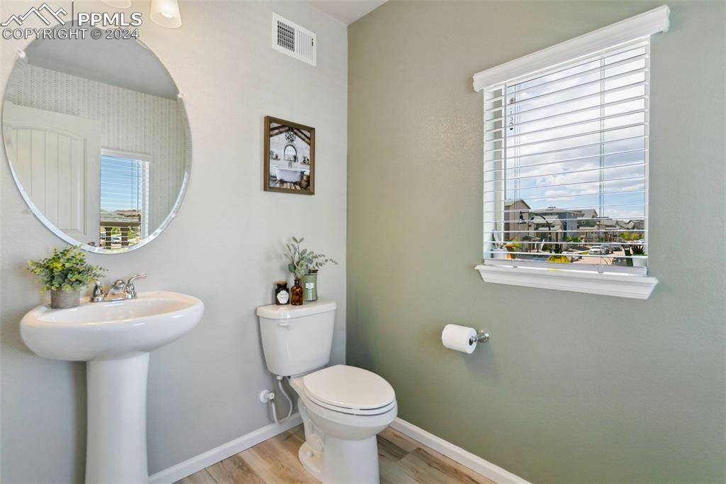 6149 Ashmore Road Colorado Springs, CO 80927 - Photo 19 of 41 a bathroom with a toilet sink and mirror