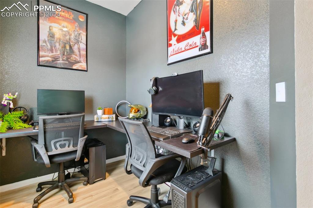 6149 Ashmore Road Colorado Springs, CO 80927 - Photo 20 of 41 a view of a workspace with furniture and a window