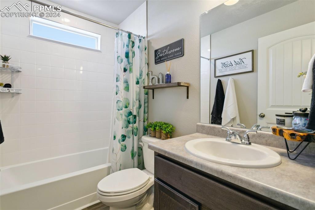 6149 Ashmore Road Colorado Springs, CO 80927 - Photo 28 of 41 a bathroom with a sink toilet and shower