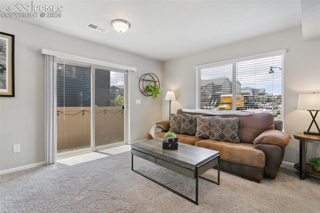 6149 Ashmore Road Colorado Springs, CO 80927 - Photo 34 of 41 a living room with furniture and a window