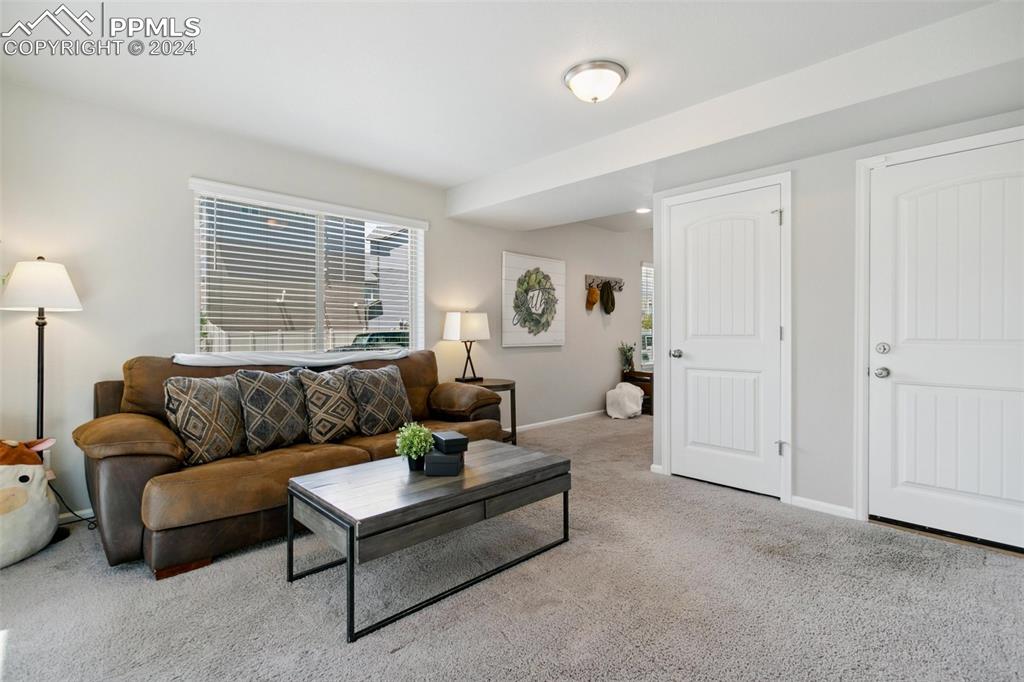 6149 Ashmore Road Colorado Springs, CO 80927 - Photo 35 of 41 a living room with furniture and a window