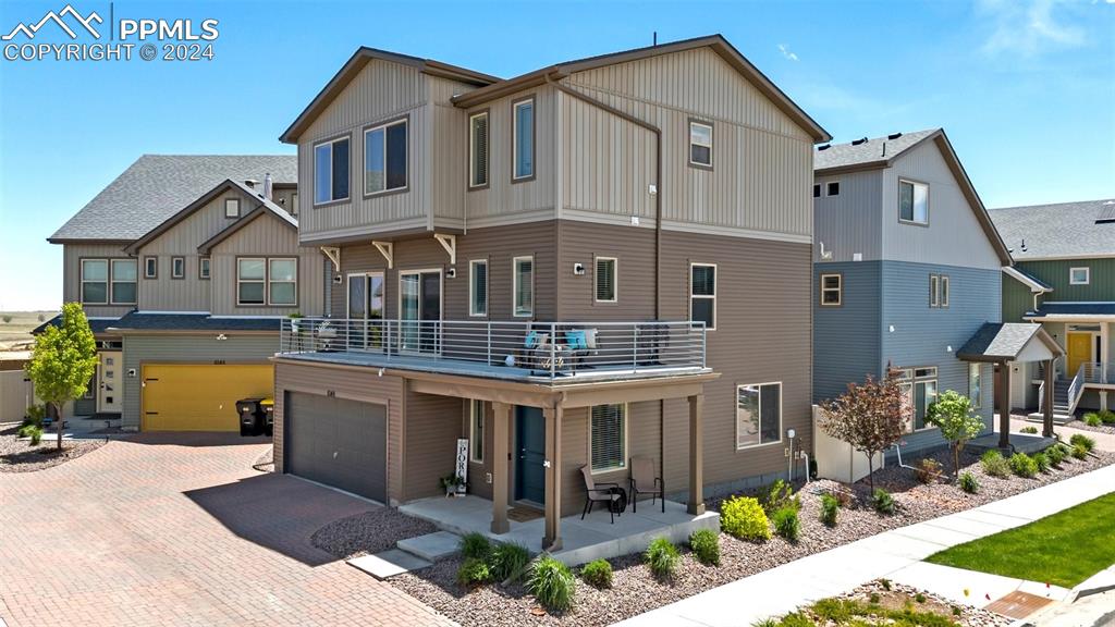 6149 Ashmore Road Colorado Springs, CO 80927 - Photo 6 of 41 a front view of a house with garden