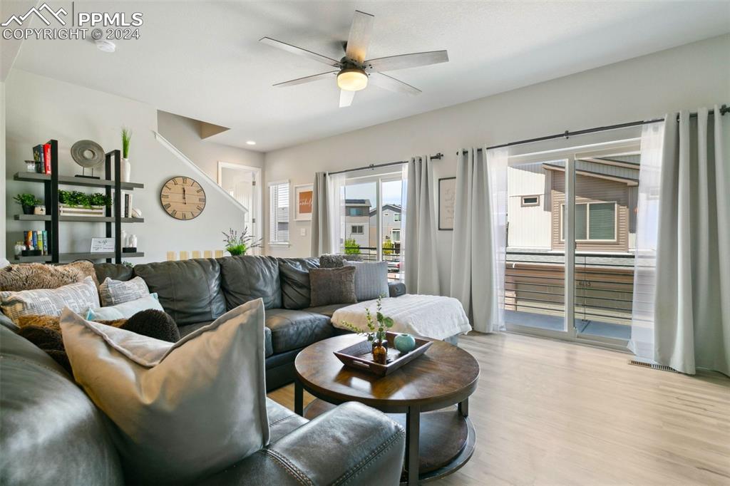 6149 Ashmore Road Colorado Springs, CO 80927 - Photo 8 of 41 a living room with furniture and wooden floor