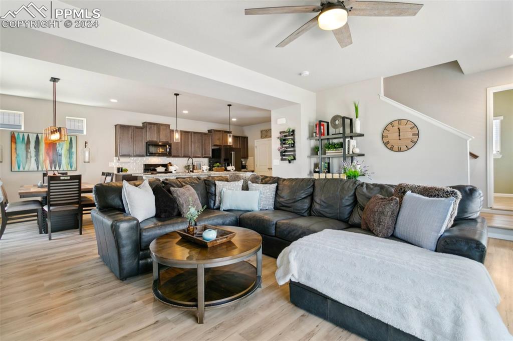 6149 Ashmore Road Colorado Springs, CO 80927 - Photo 9 of 41 a living room with furniture and kitchen view