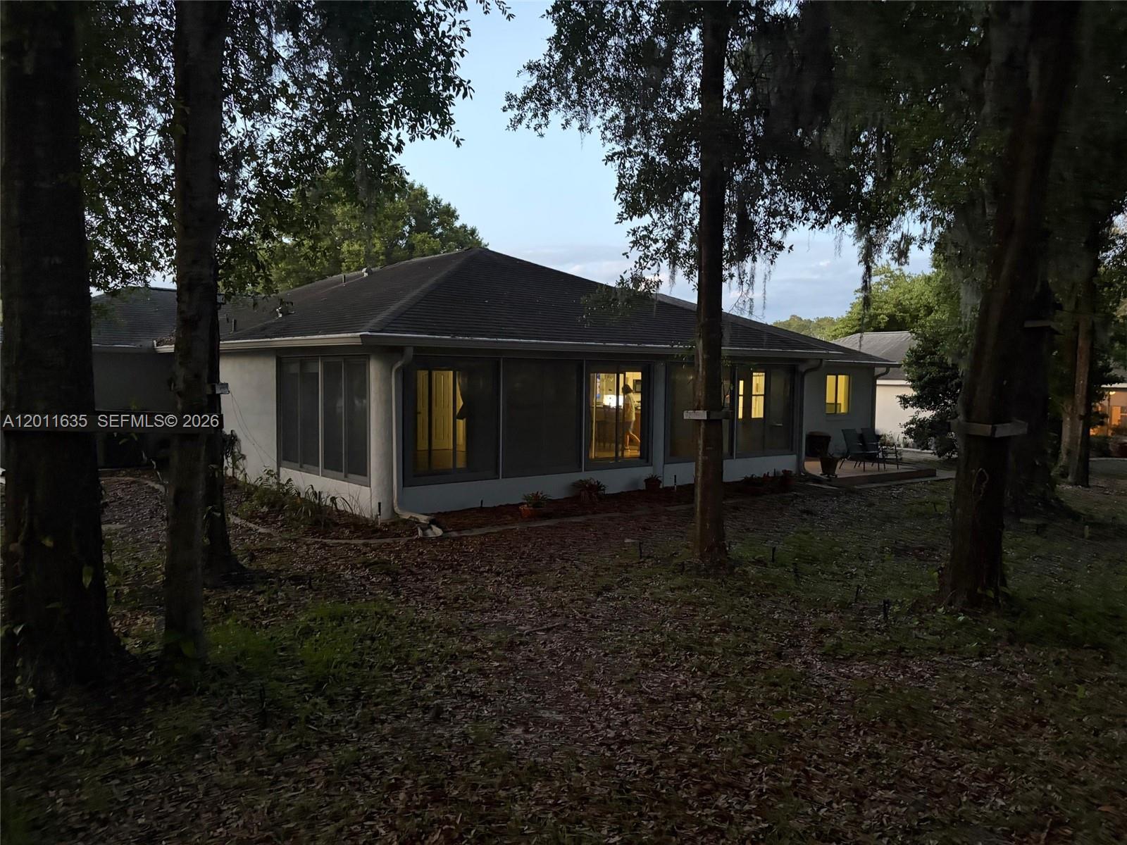 6064 Southwest 103rd Loop Ocala, FL 34476 - Photo 4 of 9 a view of a house with a yard