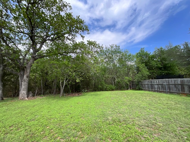 117 Allison Cove Elgin, TX 78621 - Photo 5 of 15 a backyard of a house with lots of green space