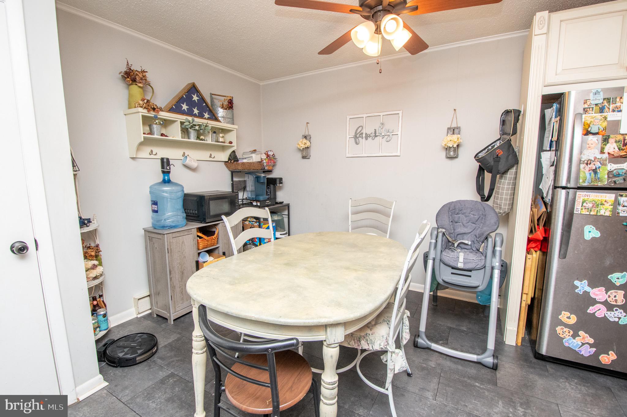 6790 Zion Church Road Salisbury, MD 21804 - Photo 5 of 13 a dining room with furniture and wooden floor