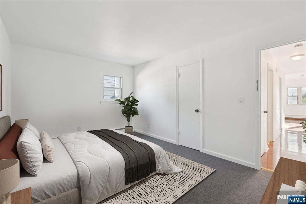 174 Clay Street Hackensack, NJ 07601 - Photo 14 of 33 a bedroom with a bed and a window