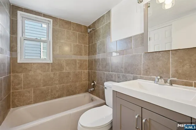a bathroom with a sink toilet and bathtub