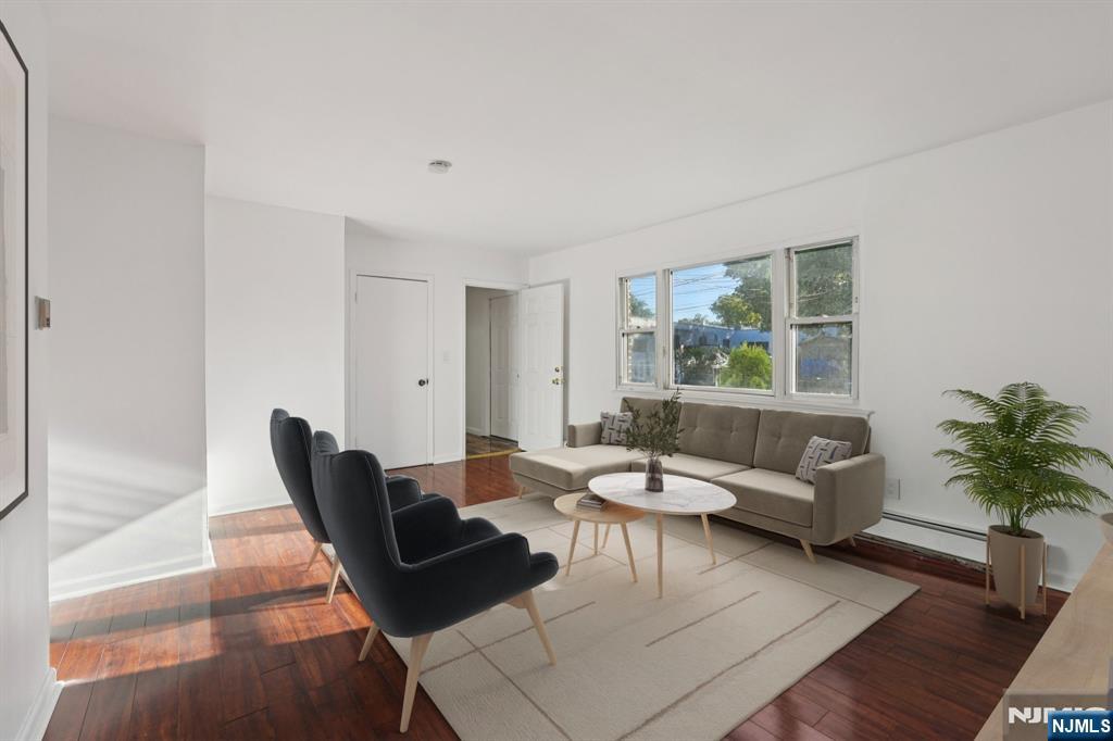 174 Clay Street Hackensack, NJ 07601 - Photo 17 of 33 a living room with furniture and a large window