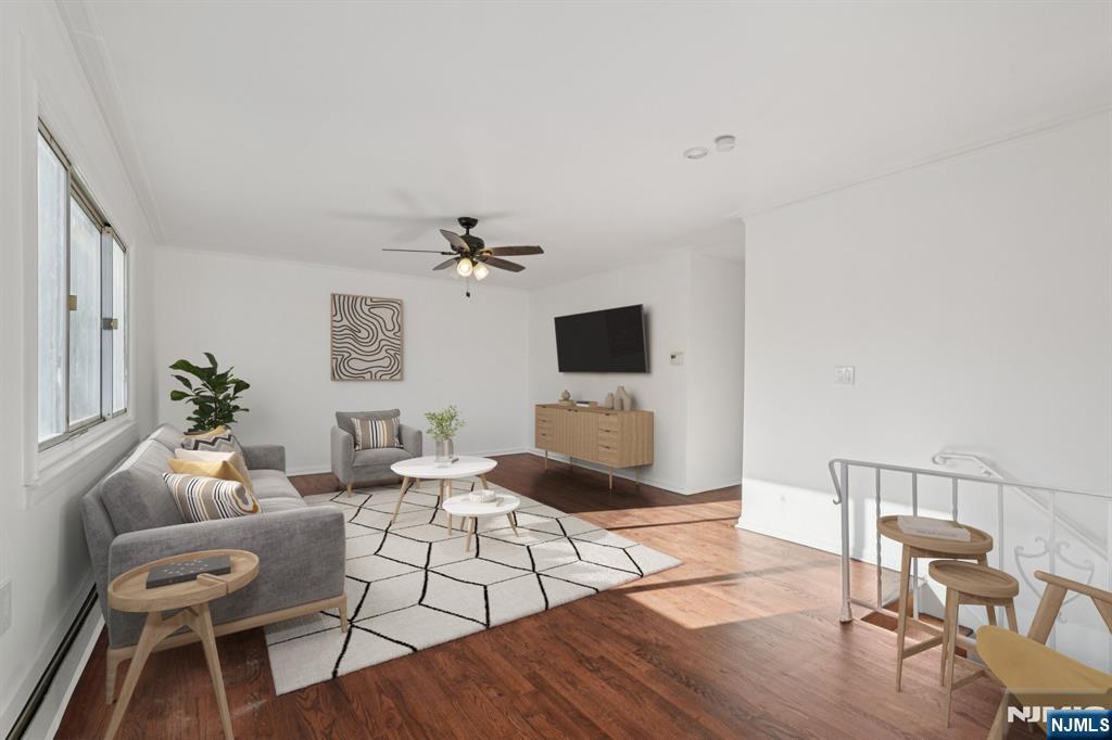 174 Clay Street Hackensack, NJ 07601 - Photo 18 of 33 a living room with furniture a flat screen tv and a table