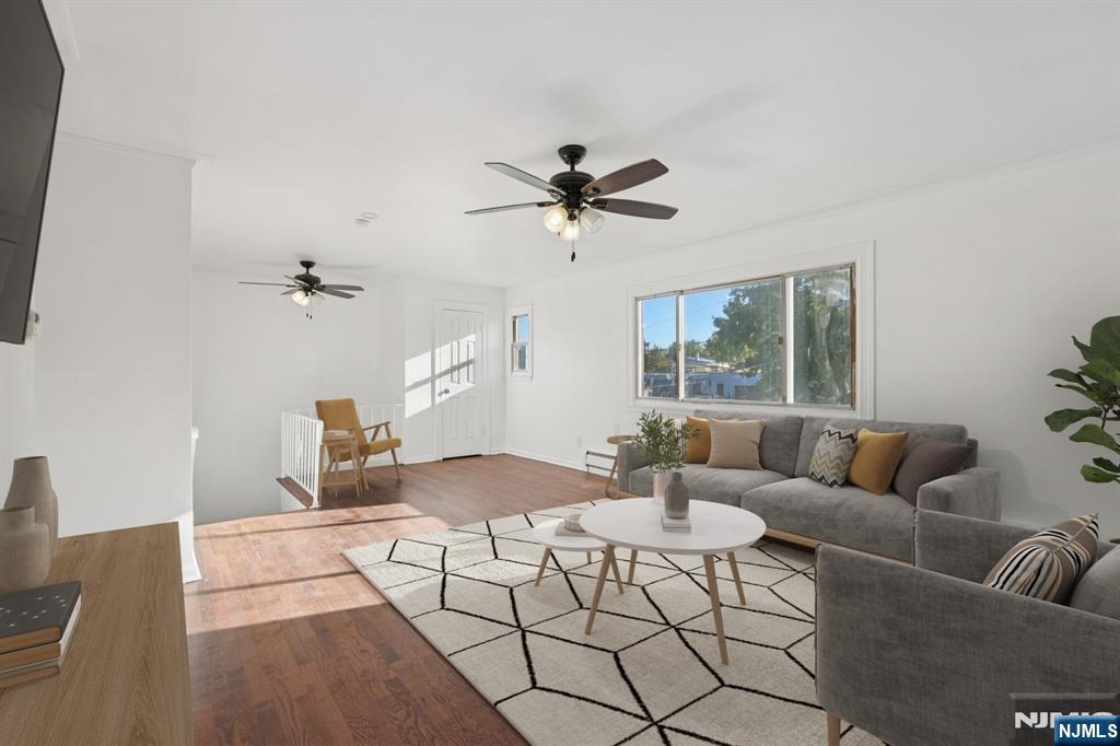 174 Clay Street Hackensack, NJ 07601 - Photo 19 of 33 a living room with furniture and a large window