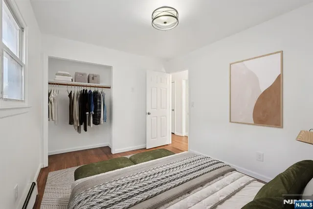 a bedroom with a bed and a walk in closet