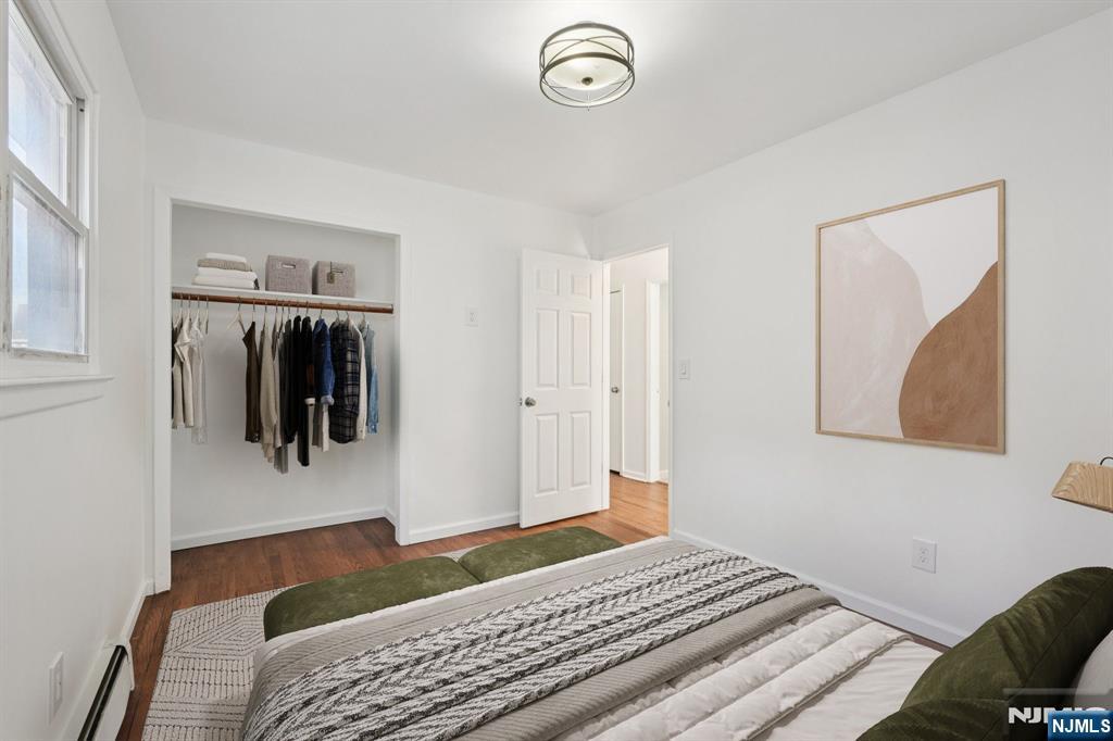174 Clay Street Hackensack, NJ 07601 - Photo 23 of 33 a bedroom with a bed and a walk in closet