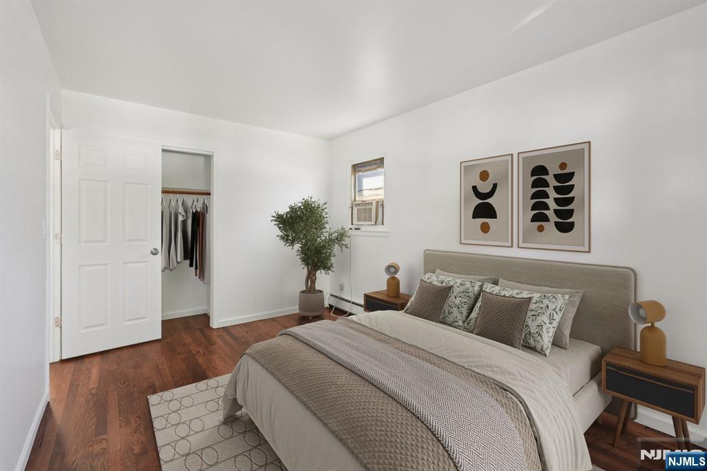 174 Clay Street Hackensack, NJ 07601 - Photo 24 of 33 a bedroom with a large bed and a dresser