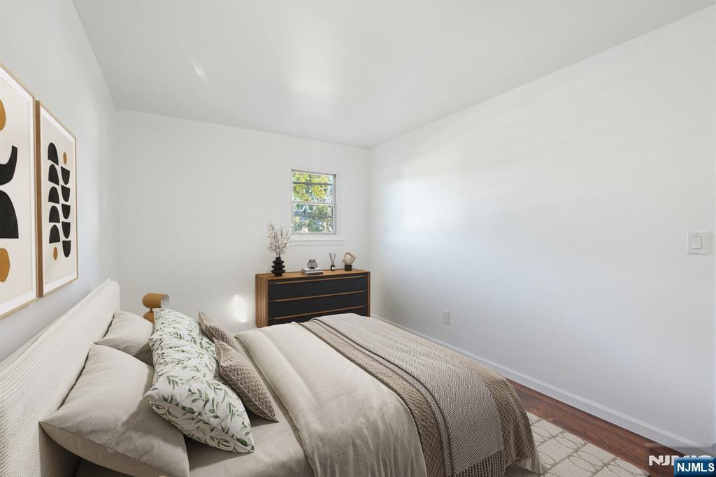 174 Clay Street Hackensack, NJ 07601 - Photo 25 of 33 a bedroom with a bed and a window