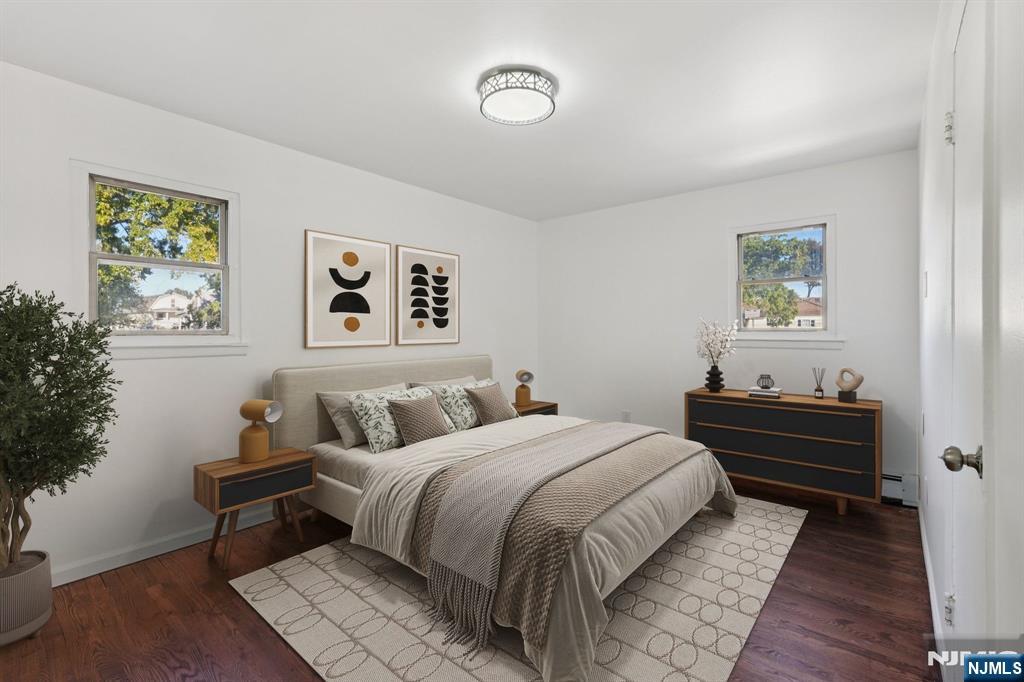 174 Clay Street Hackensack, NJ 07601 - Photo 26 of 33 a bedroom with a bed and a lamp on the dresser