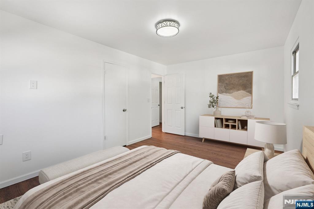 174 Clay Street Hackensack, NJ 07601 - Photo 28 of 33 a bedroom with a bed and a couch