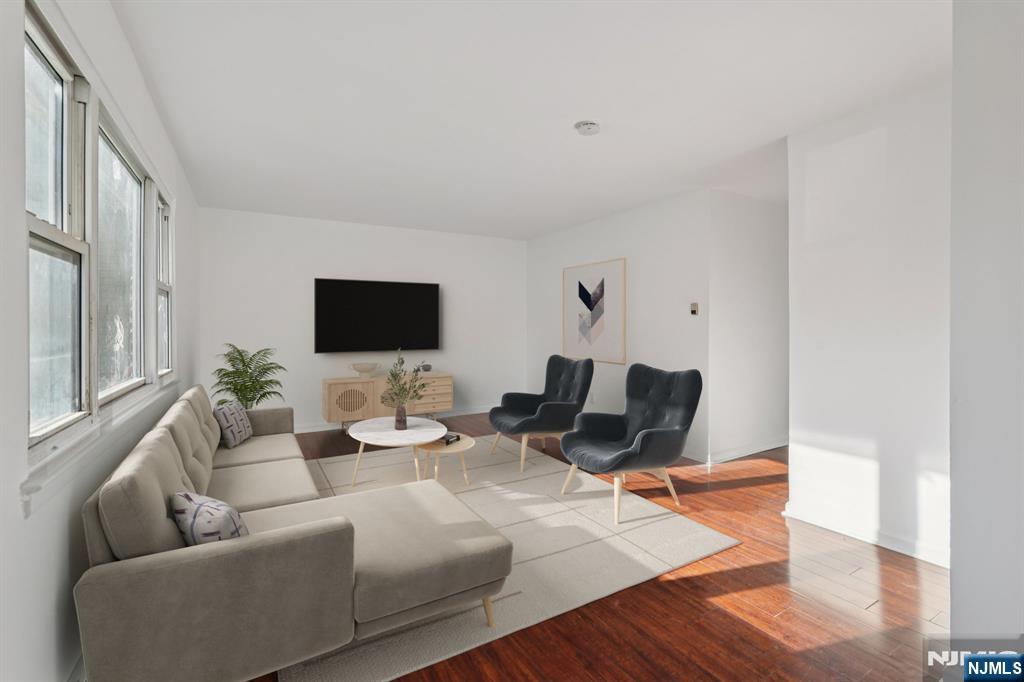 174 Clay Street Hackensack, NJ 07601 - Photo 4 of 33 a living room with furniture wooden floor and a flat screen tv