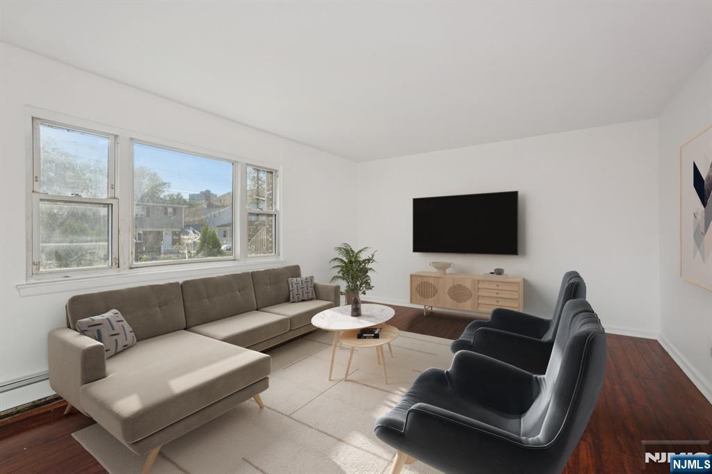 174 Clay Street Hackensack, NJ 07601 - Photo 5 of 33 a living room with furniture and a flat screen tv