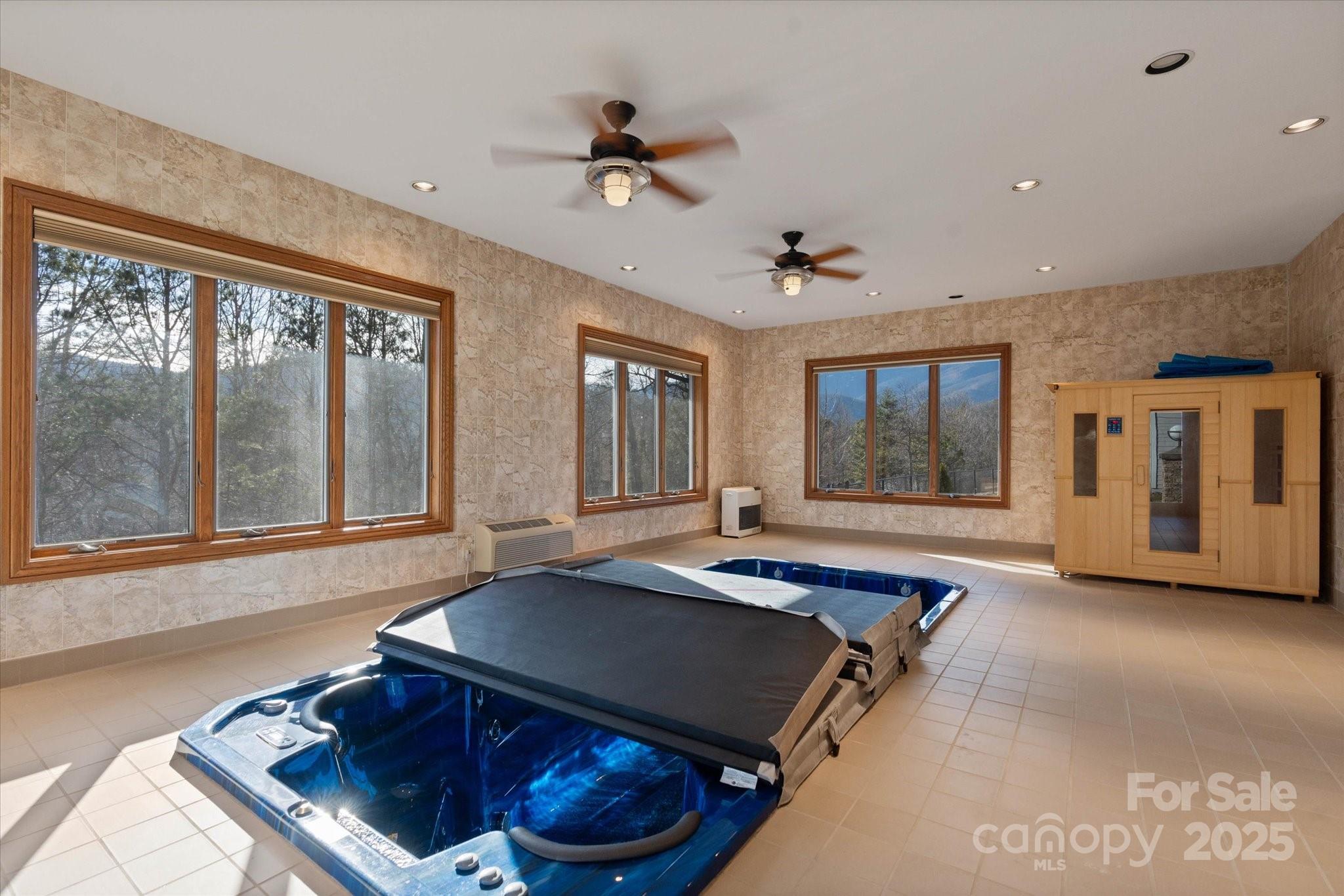 151 Pine Ridge Road Burnsville, NC 28714 - Photo 17 of 48 a living room with furniture pool table and a large window