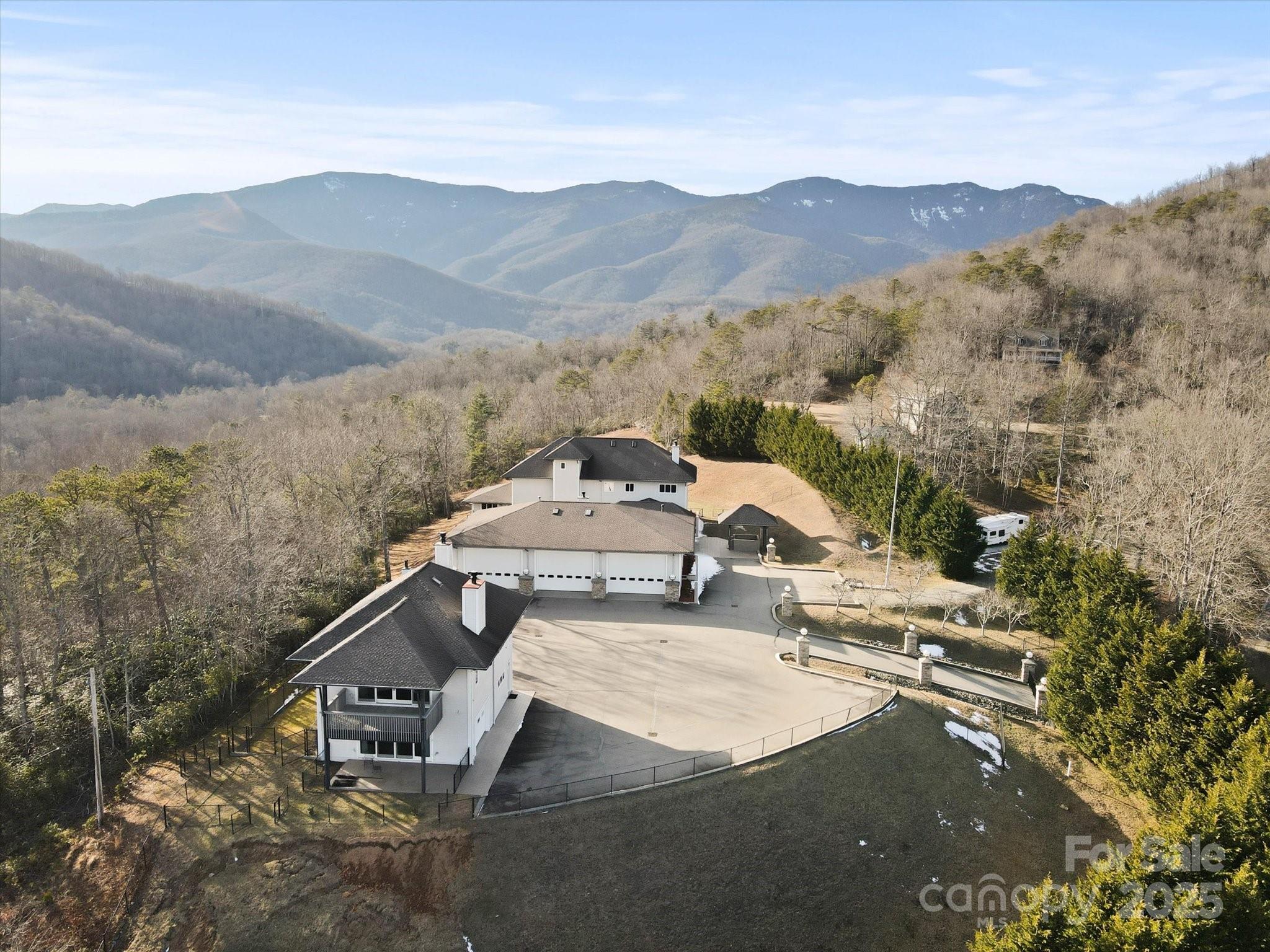 151 Pine Ridge Road Burnsville, NC 28714 - Photo 2 of 48 a view of a house with a mountain