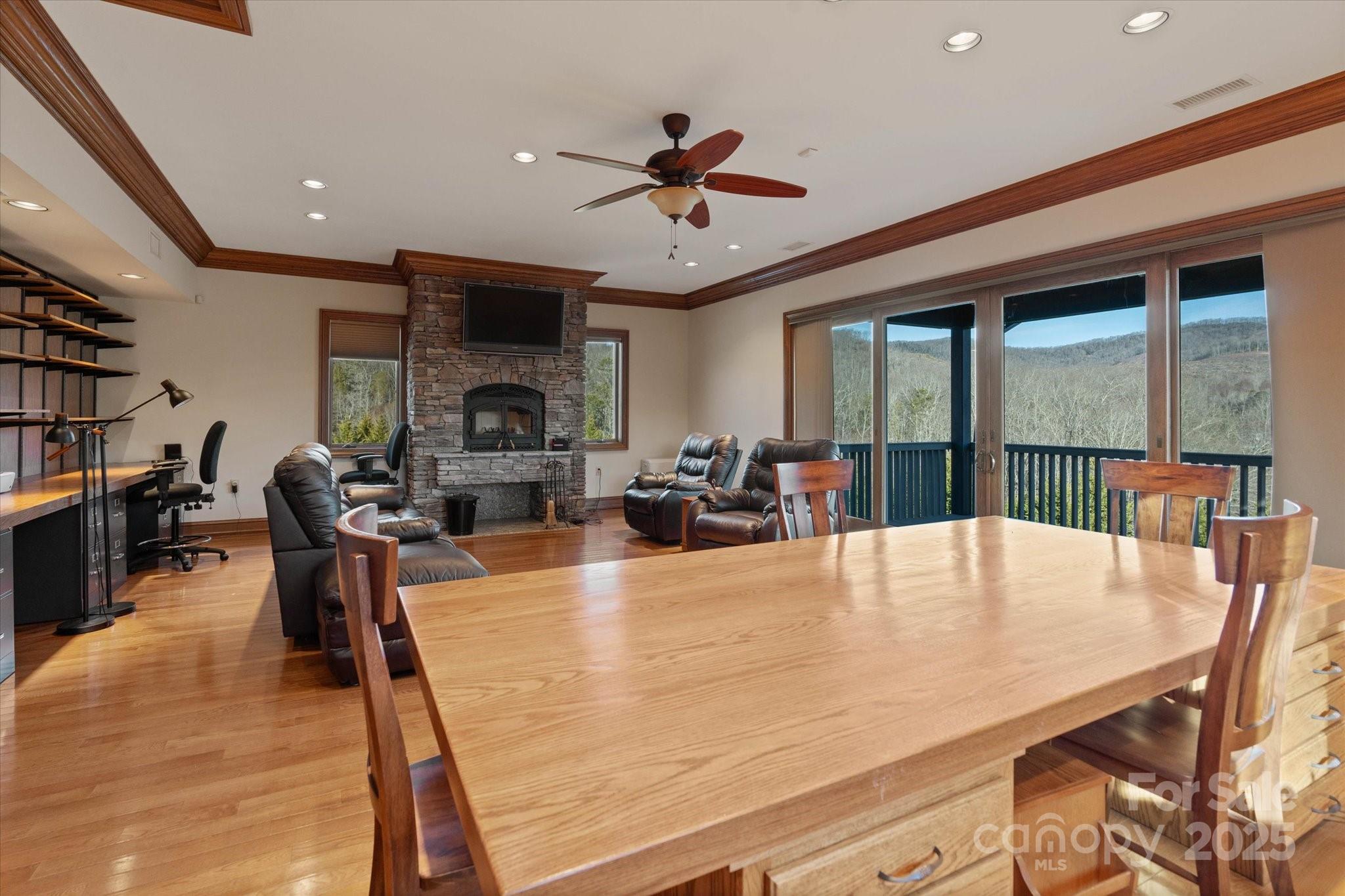 151 Pine Ridge Road Burnsville, NC 28714 - Photo 44 of 48 a view of a dining room with furniture window and wooden floor
