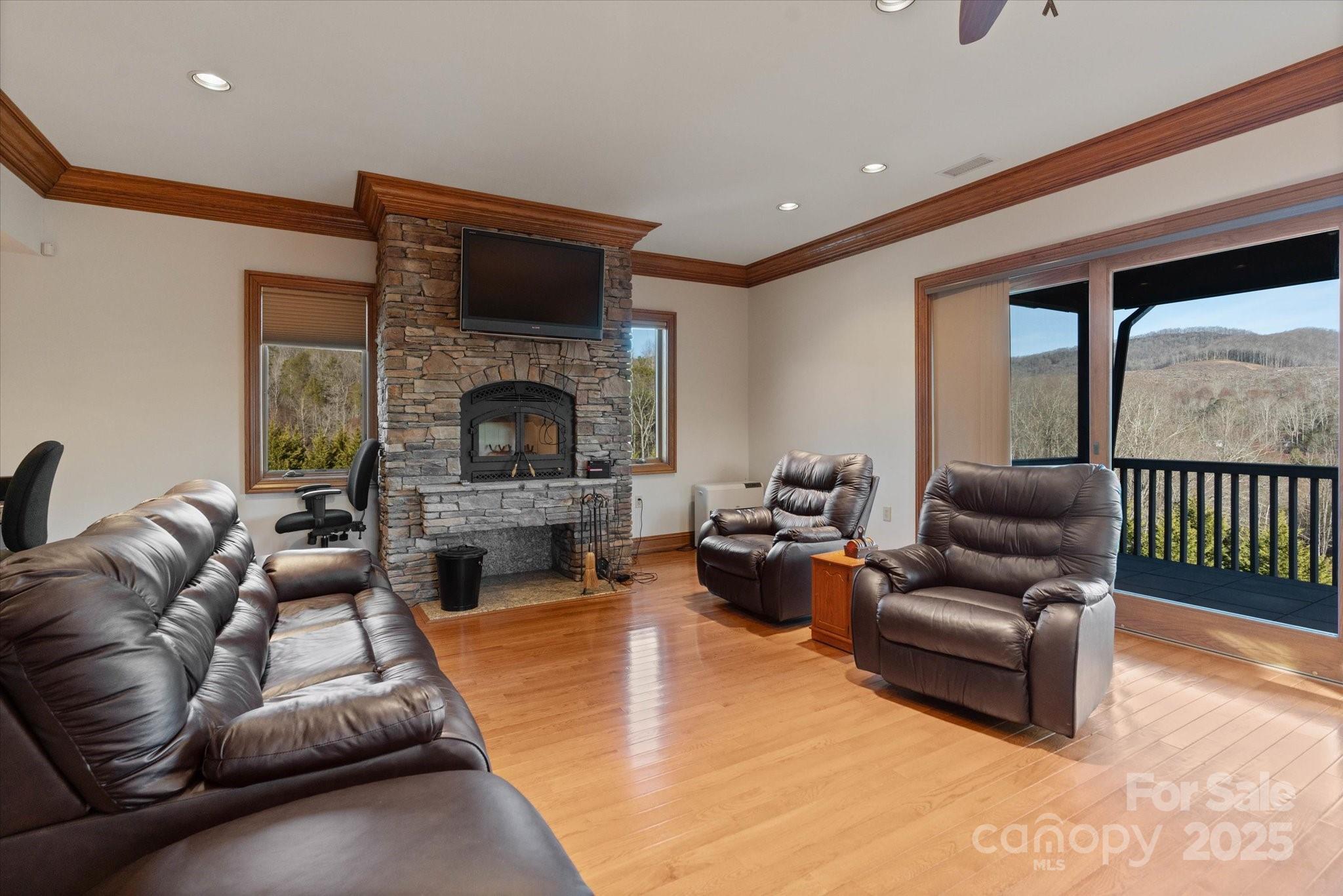 151 Pine Ridge Road Burnsville, NC 28714 - Photo 45 of 48 a living room with furniture and a fireplace