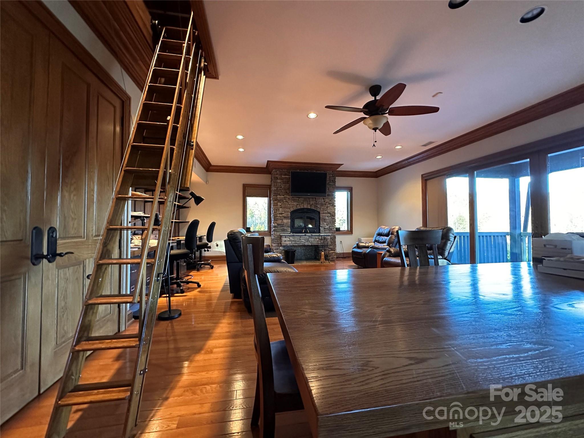151 Pine Ridge Road Burnsville, NC 28714 - Photo 47 of 48 a view of a dining room with furniture and wooden floor