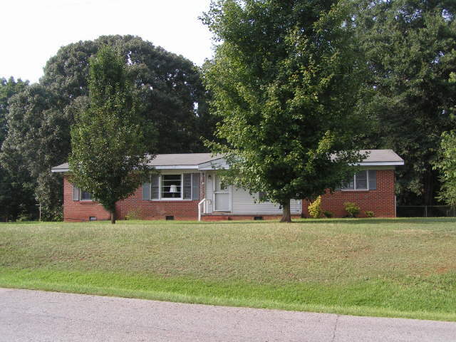 202 Harp Road Thomaston, GA 30286 - Photo 1 of 1 a front view of house with yard
