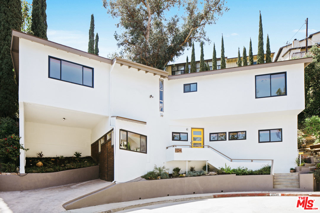 2538 Ridgeview Avenue Los Angeles, CA 90041 - Photo 1 of 31 a front view of a house with a yard