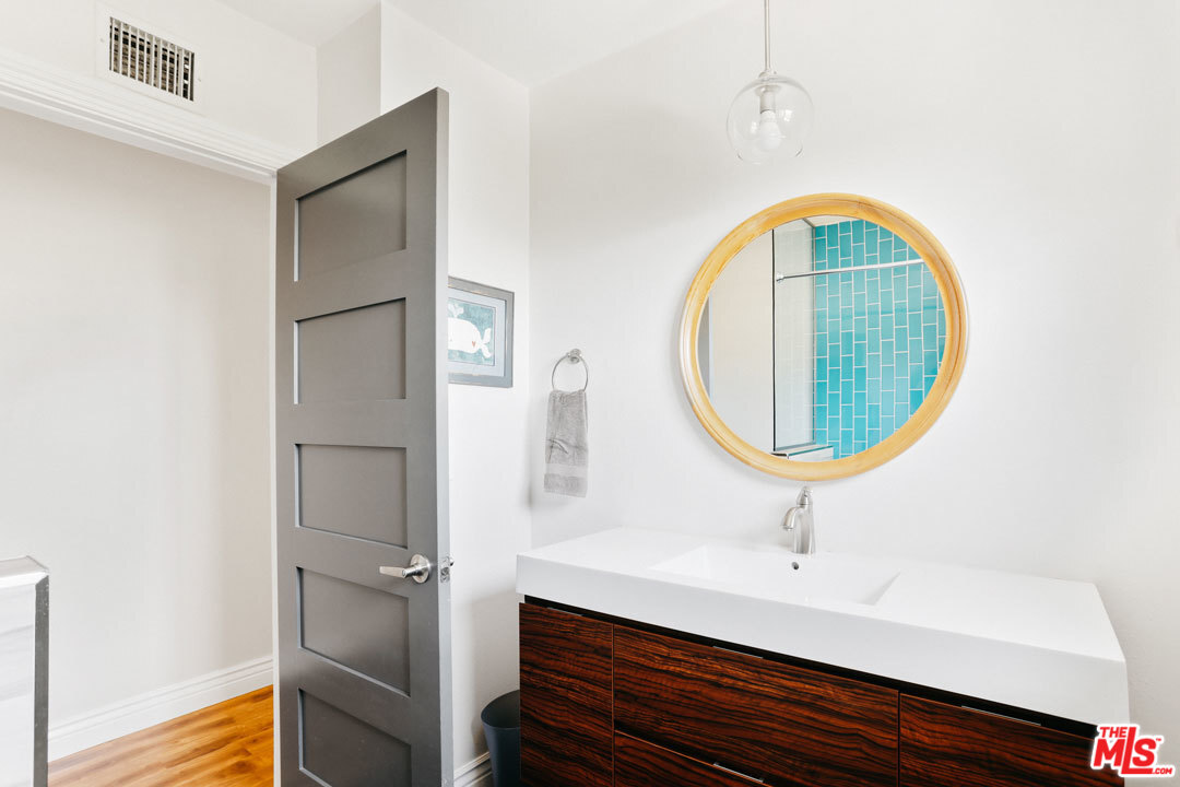 2538 Ridgeview Avenue Los Angeles, CA 90041 - Photo 12 of 31 a room with a sink and mirror