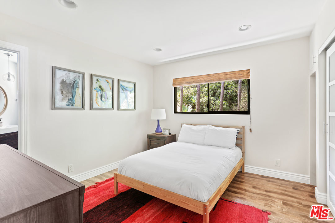 2538 Ridgeview Avenue Los Angeles, CA 90041 - Photo 14 of 31 a bedroom with a bed and a window