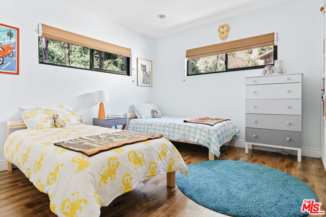 2538 Ridgeview Avenue Los Angeles, CA 90041 - Photo 19 of 31 a bedroom with bed and window
