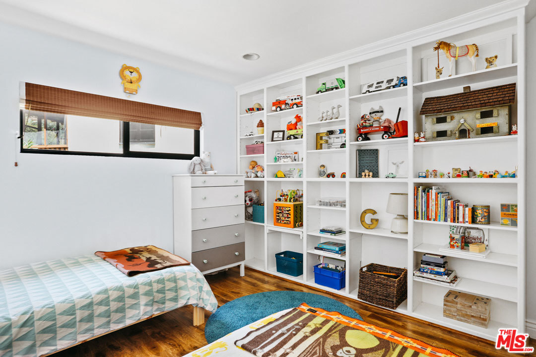 2538 Ridgeview Avenue Los Angeles, CA 90041 - Photo 20 of 31 a room with furniture and a book shelf