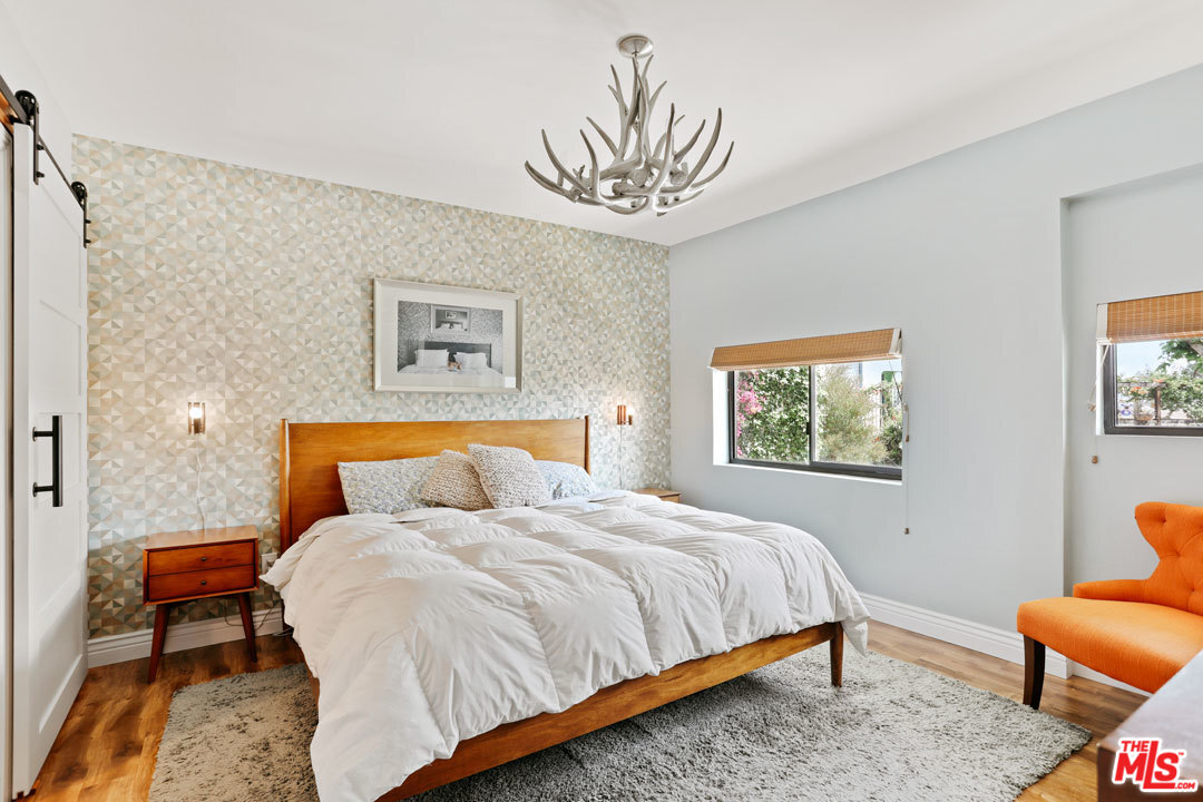 2538 Ridgeview Avenue Los Angeles, CA 90041 - Photo 22 of 31 a bedroom with a bed and a couch