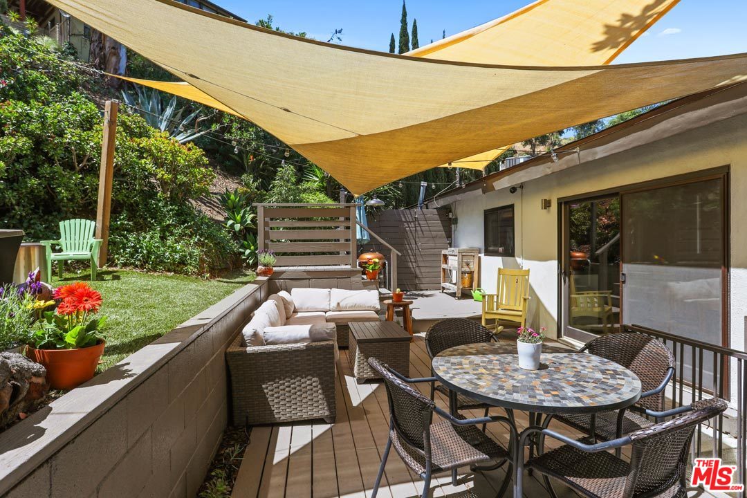 2538 Ridgeview Avenue Los Angeles, CA 90041 - Photo 8 of 31 a outdoor dining space with furniture and flowers