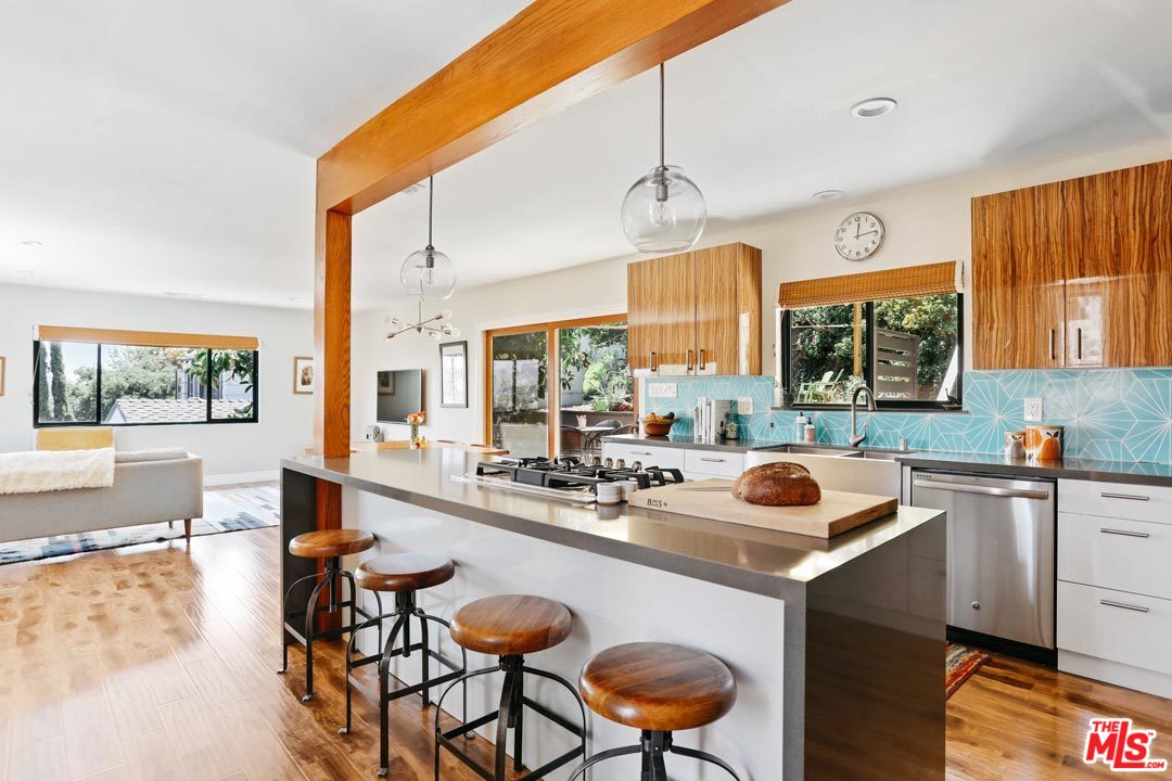 2538 Ridgeview Avenue Los Angeles, CA 90041 - Photo 9 of 31 a kitchen with a sink a counter and chairs