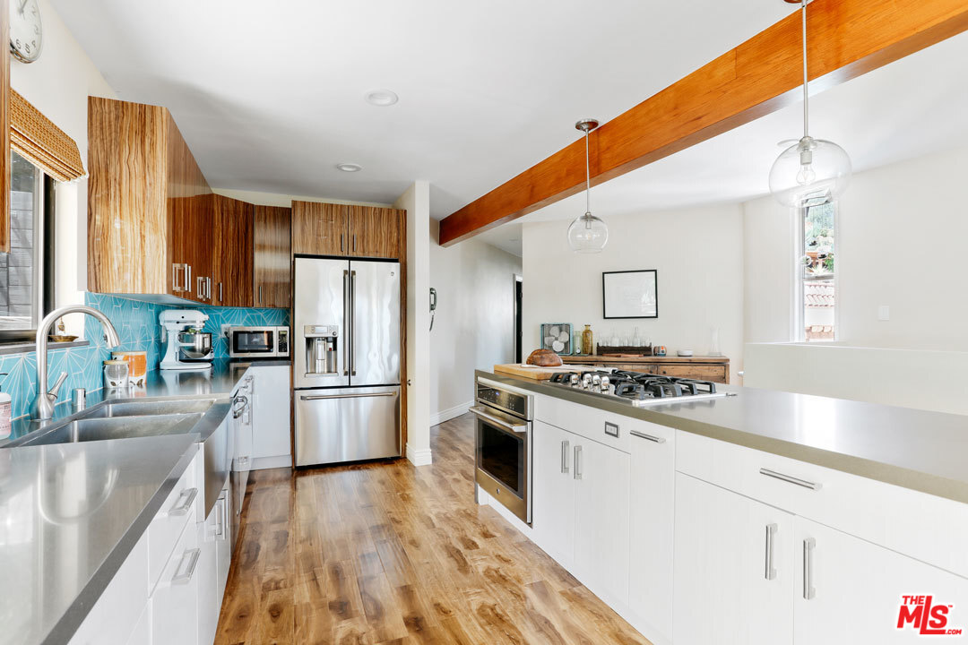 2538 Ridgeview Avenue Los Angeles, CA 90041 - Photo 10 of 31 a kitchen with a stove a sink and a refrigerator