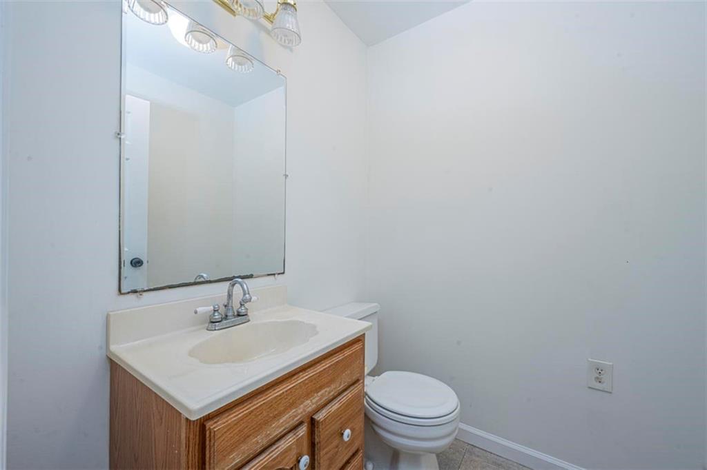 1752 Mitzi Court Duluth, GA 30097 - Photo 21 of 41 a bathroom with a sink toilet and a mirror