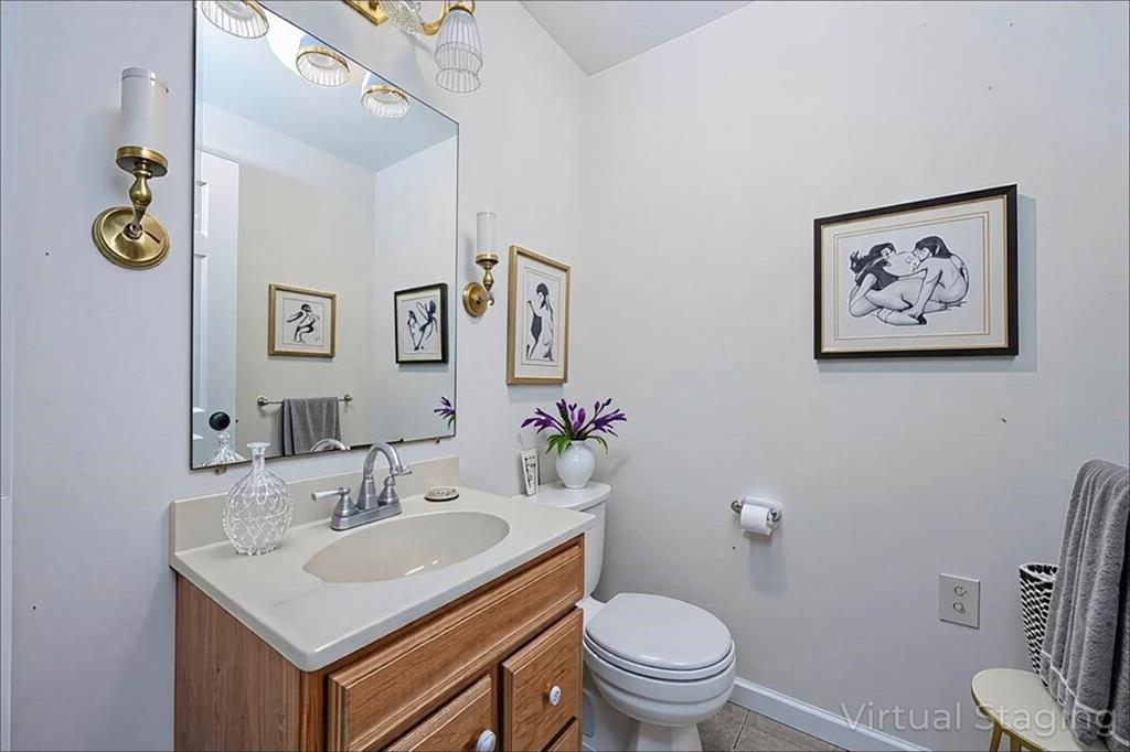 1752 Mitzi Court Duluth, GA 30097 - Photo 22 of 41 a bathroom with a sink mirror and toilet
