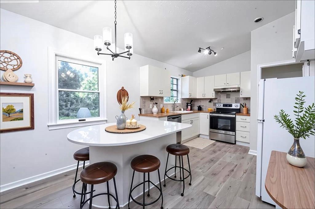1752 Mitzi Court Duluth, GA 30097 - Photo 24 of 41 a view of a dining room with furniture window and wooden floor