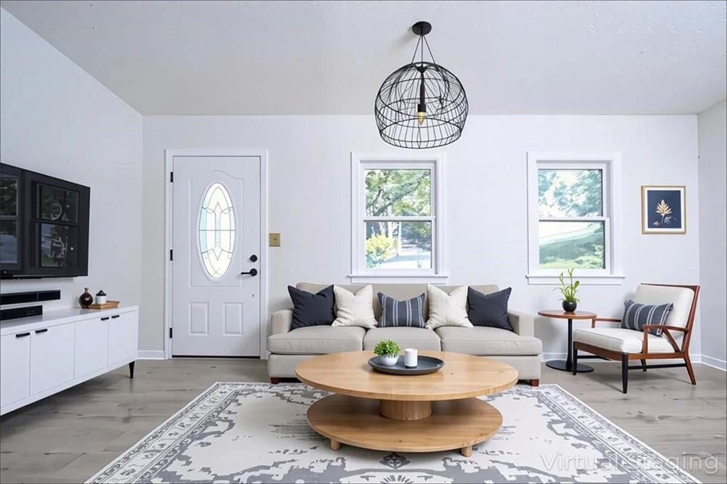 1752 Mitzi Court Duluth, GA 30097 - Photo 29 of 41 a living room with furniture a rug and a window