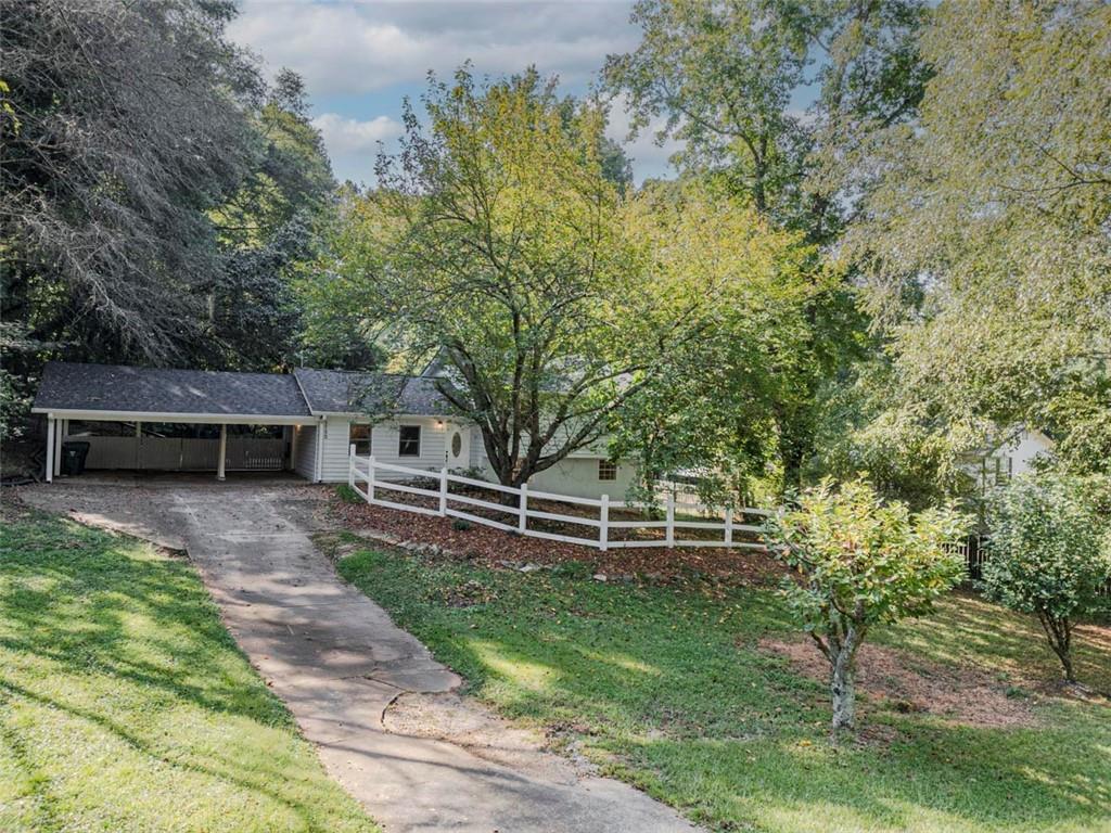 1752 Mitzi Court Duluth, GA 30097 - Photo 38 of 41 a front view of a house with a garden