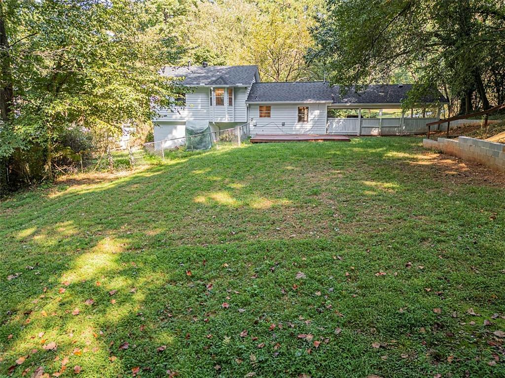 1752 Mitzi Court Duluth, GA 30097 - Photo 4 of 41 a front view of a house with a garden