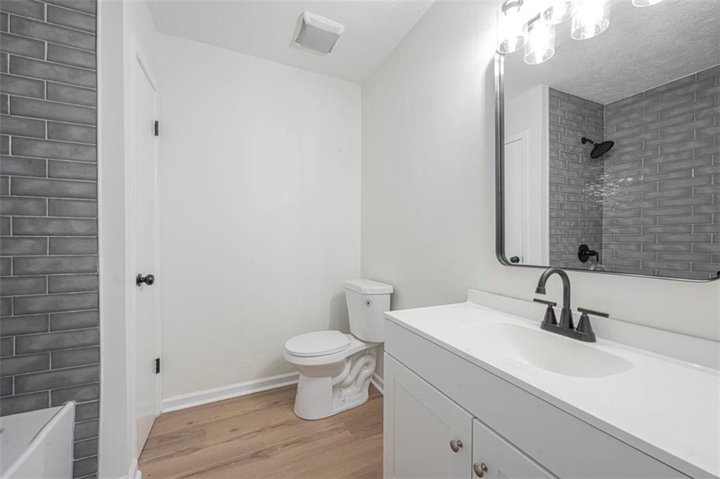 1752 Mitzi Court Duluth, GA 30097 - Photo 6 of 41 a bathroom with a sink and a mirror