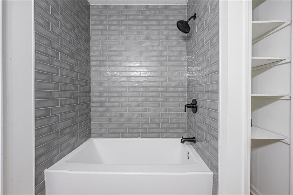 1752 Mitzi Court Duluth, GA 30097 - Photo 7 of 41 a bathroom with a bathtub
