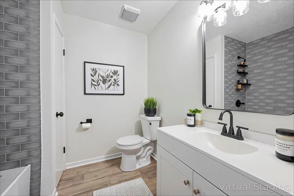 1752 Mitzi Court Duluth, GA 30097 - Photo 8 of 41 a bathroom with a sink a toilet and shower