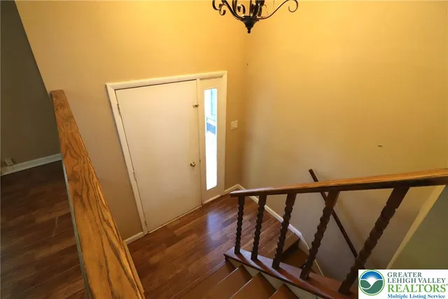 a view of balcony with wooden floor and stairs